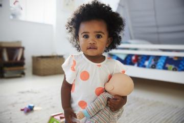 Little girl with doll